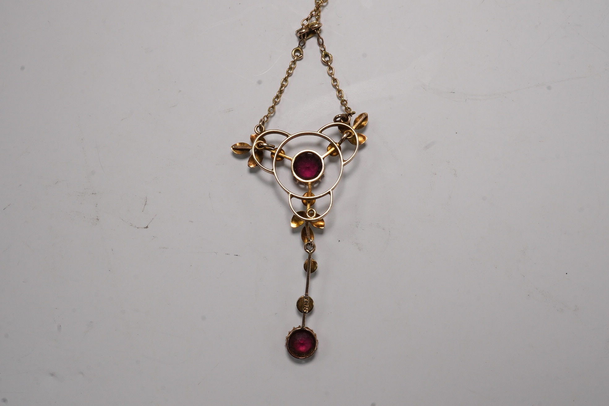 An Edwardian 9ct and gem set drop pendant necklace, pendant 43mm, chain tangled Condition - poor to fair